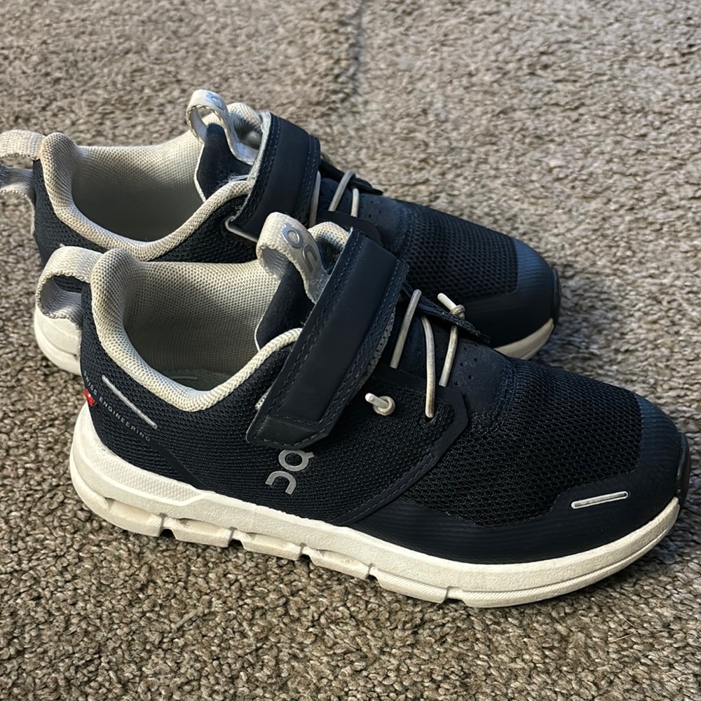 On Running Black and White Sneakers with Cushioned Design